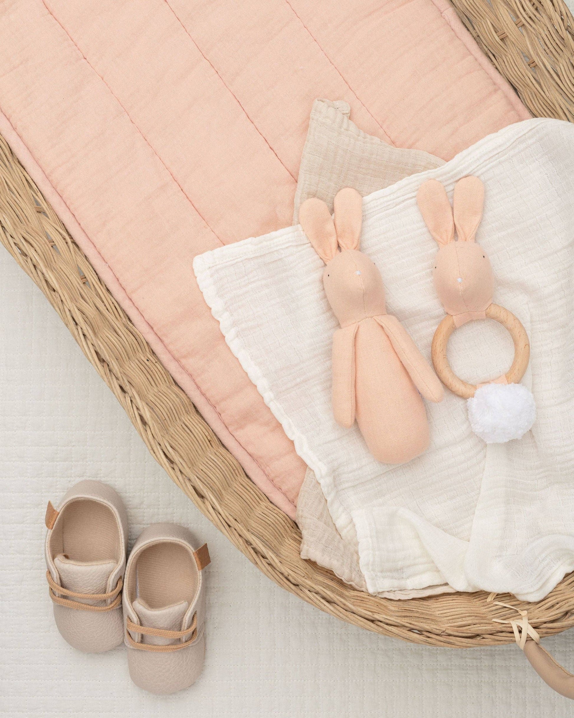 Pale Pink Rabbit head, and a white fluffy pom pom tail. Introducing our adorable rabbit teether, designed to provide comfort and relief during the teething phase.