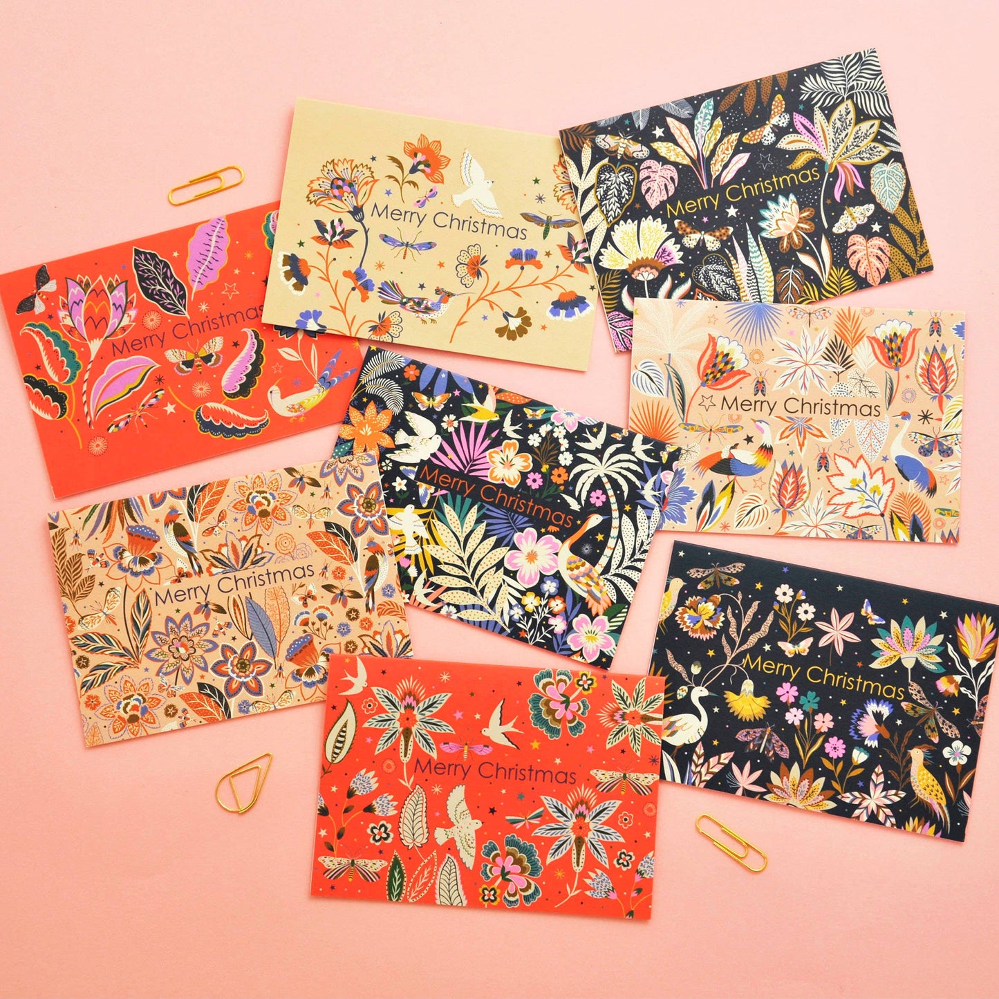 Vibrant Christmas notecard with flora and fauna design and 'Merry Christmas' message.