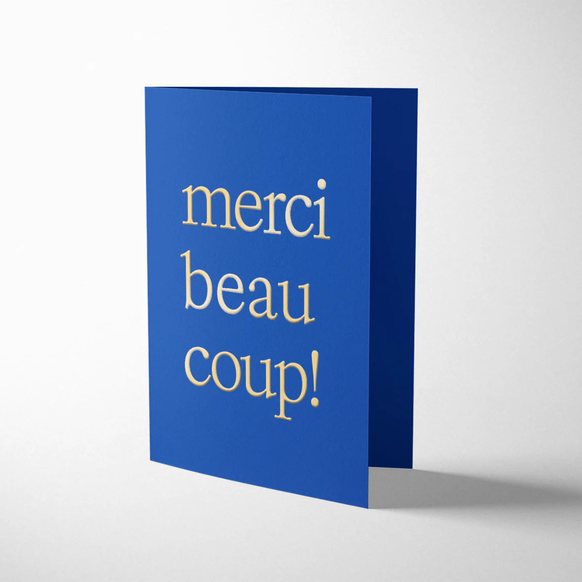 Darling Clementine French Twist Merci Beaucoup! card, letterpress printed on indigo board with gold foil details, bubblegum pink envelope, 108mm x 140mm.