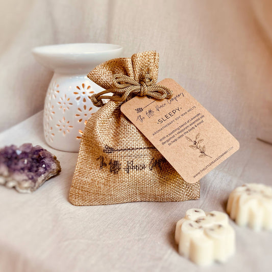 Hand-poured Sleepy Soy Wax Melts with soothing Lavender, Bergamot, and Marjoram essential oils, featuring dried English Lavender, in eco-friendly burlap packaging.