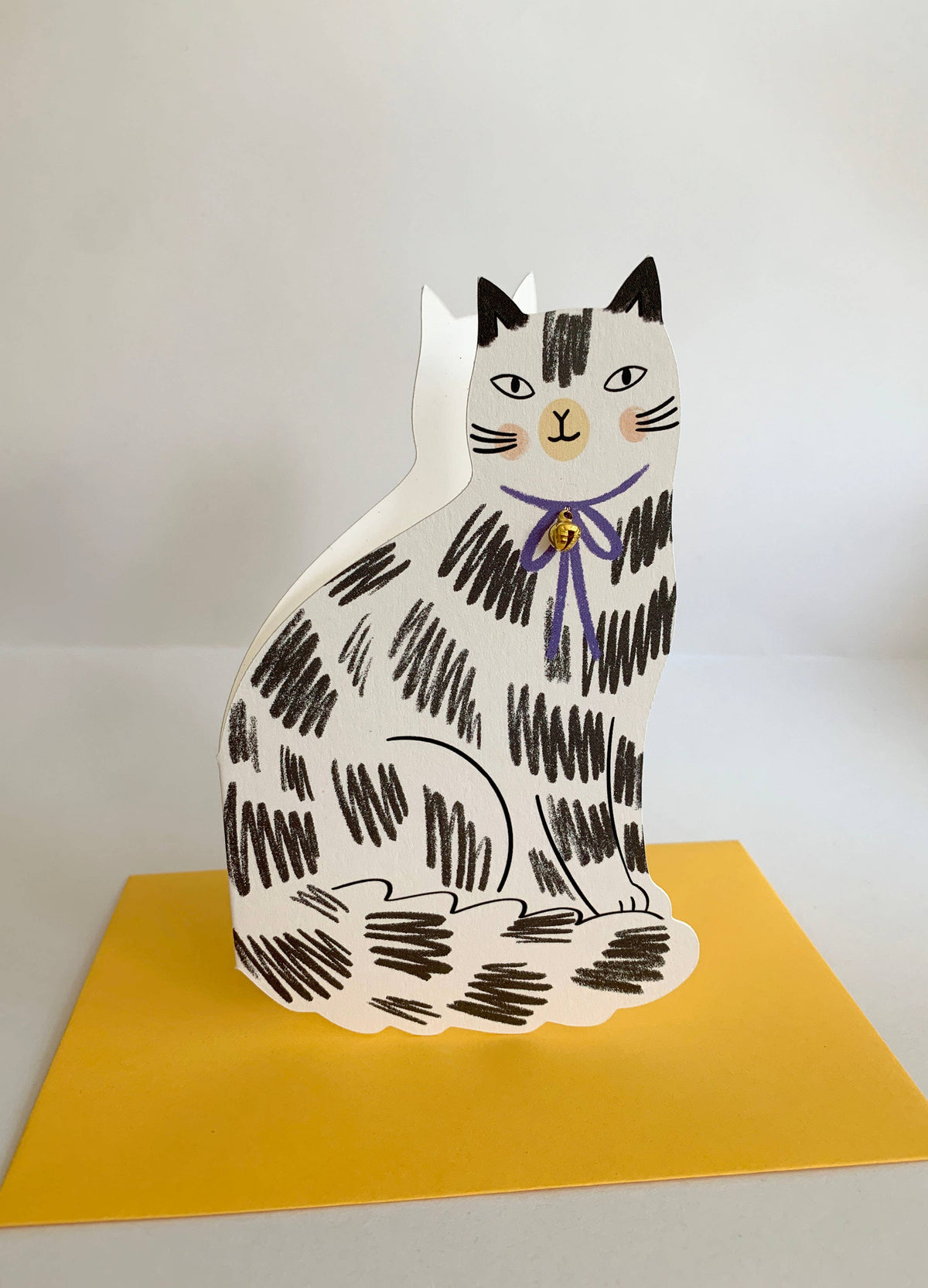 Playful loveheart cat shaped card