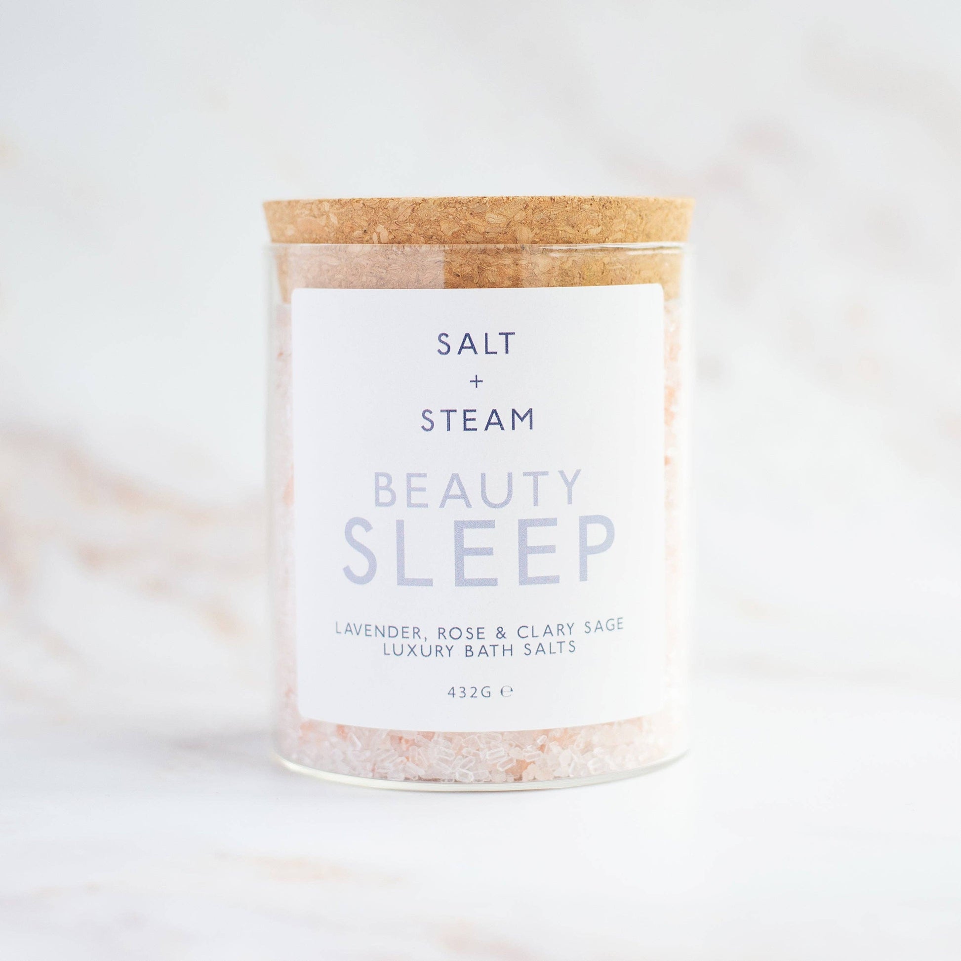 Beauty Sleep Lavender Rose and Clary Sage bath salts in glass jar.