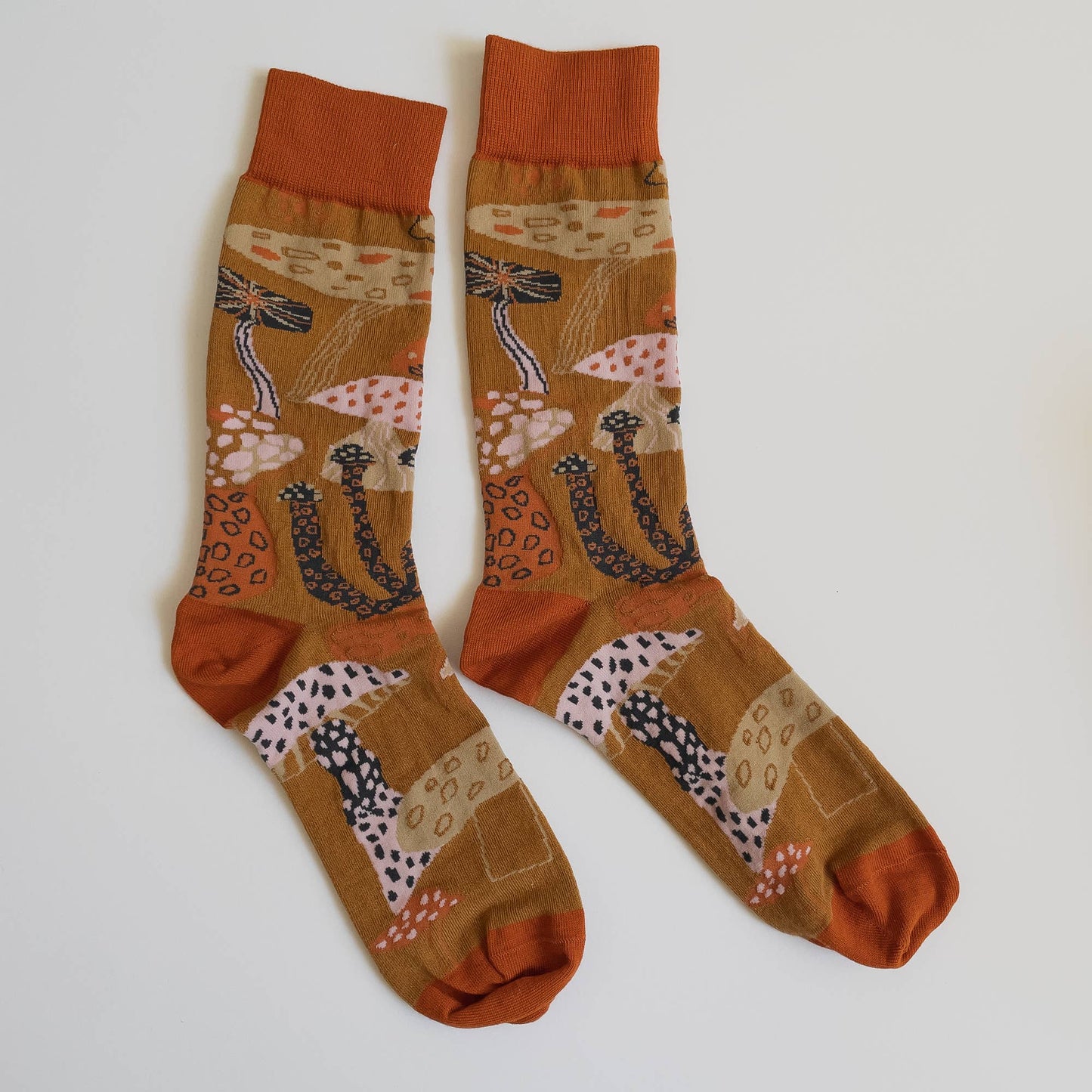 James Barker Mushroom socks in five colours, illustrated nature pattern, made from combed cotton.