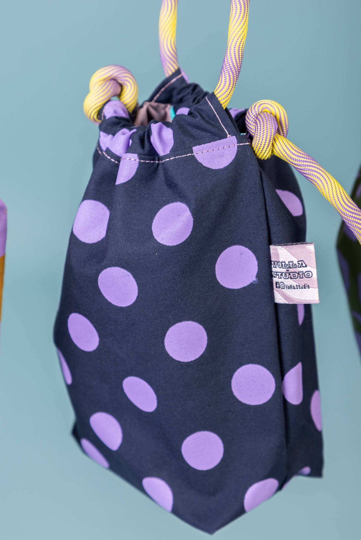 Handmade waxed cotton festival bag close up