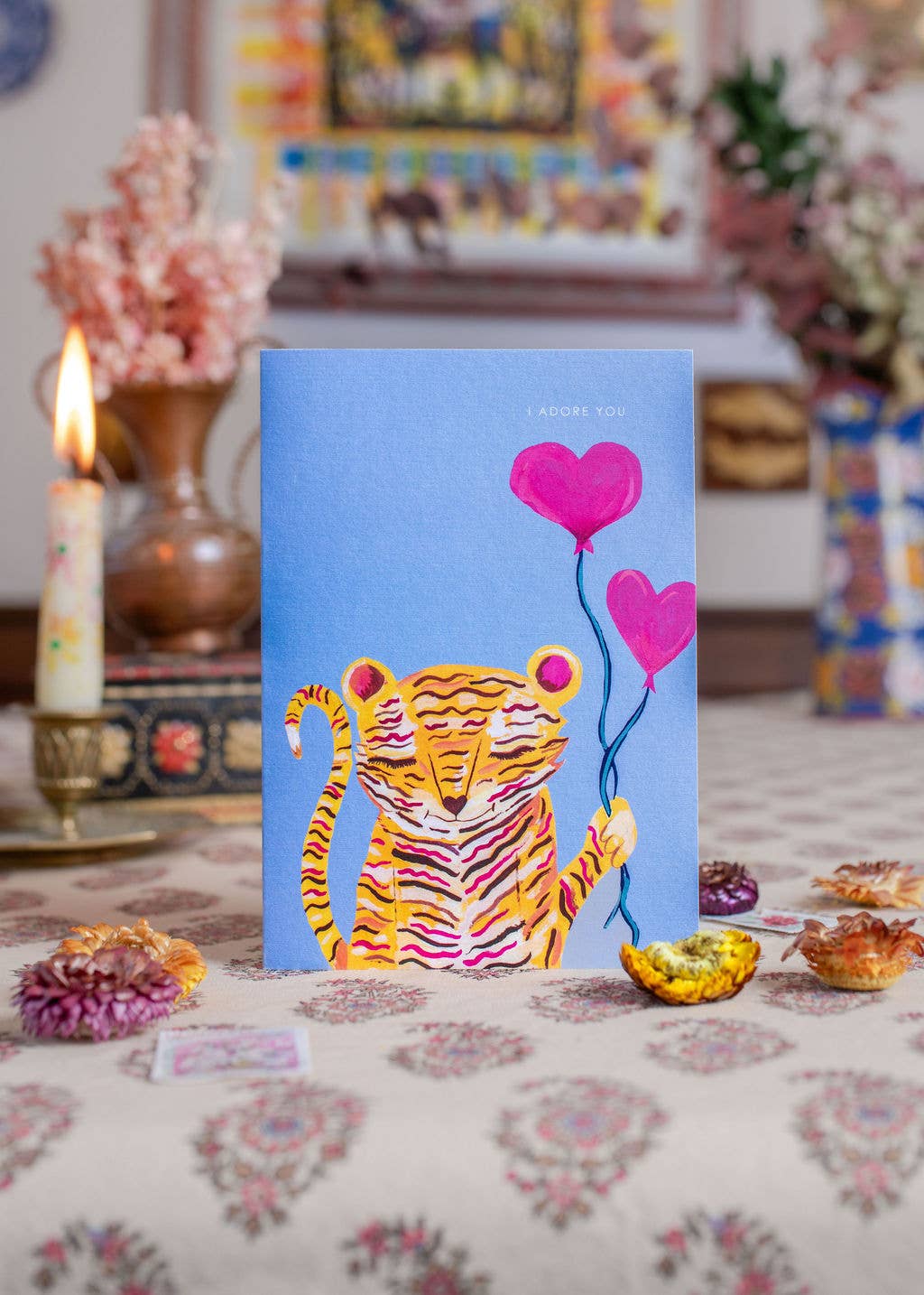 Close up of tiger with heart balloons card design