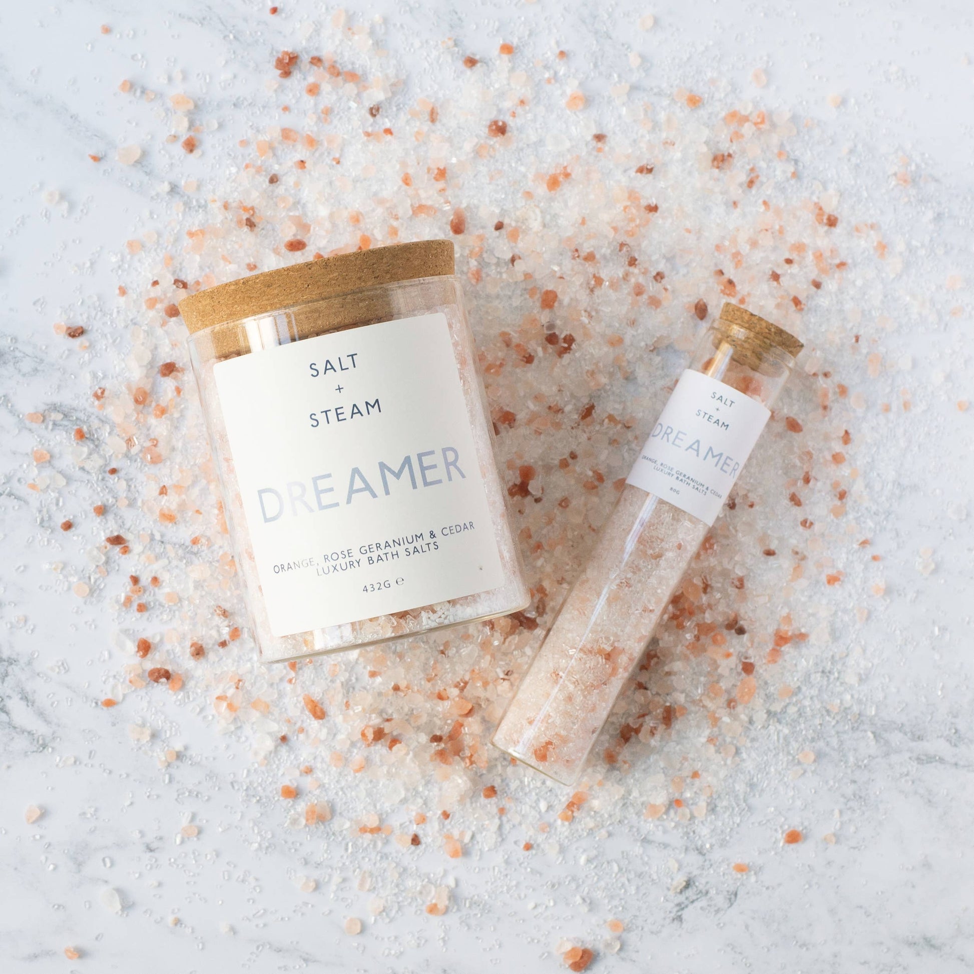 Floral and woody scented vegan bath salts in plastic-free packaging.
