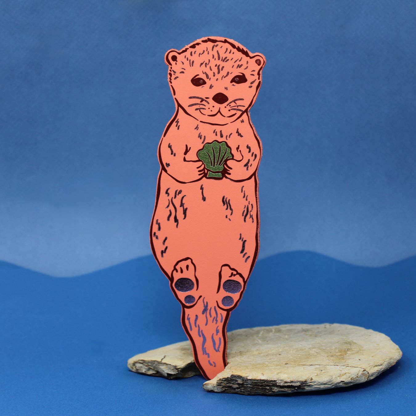 Handmade leather otter bookmark, embossed with Otterly Relaxed, British made by Ark Colour Design.