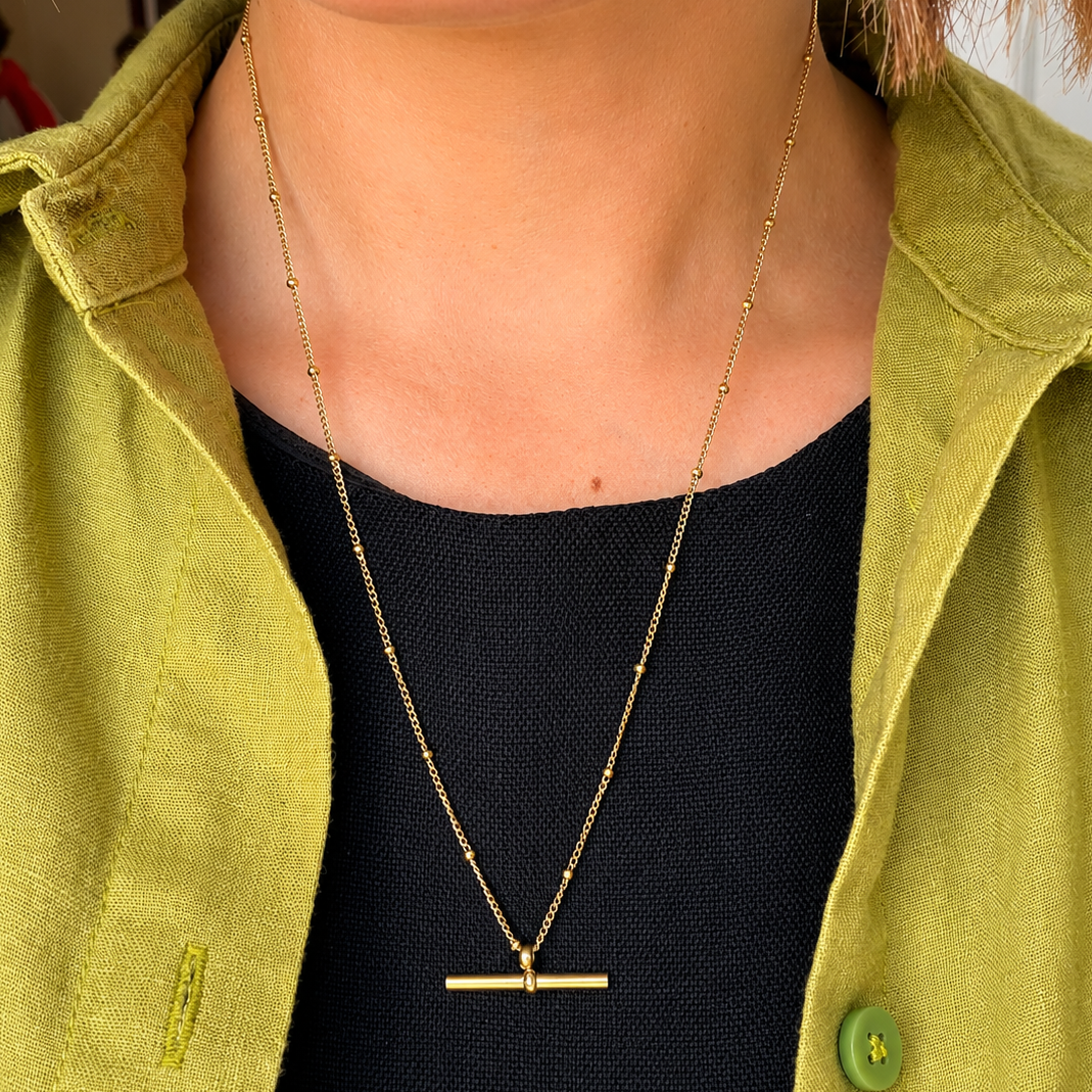 Close up of waterproof gold bar pendant jewellery