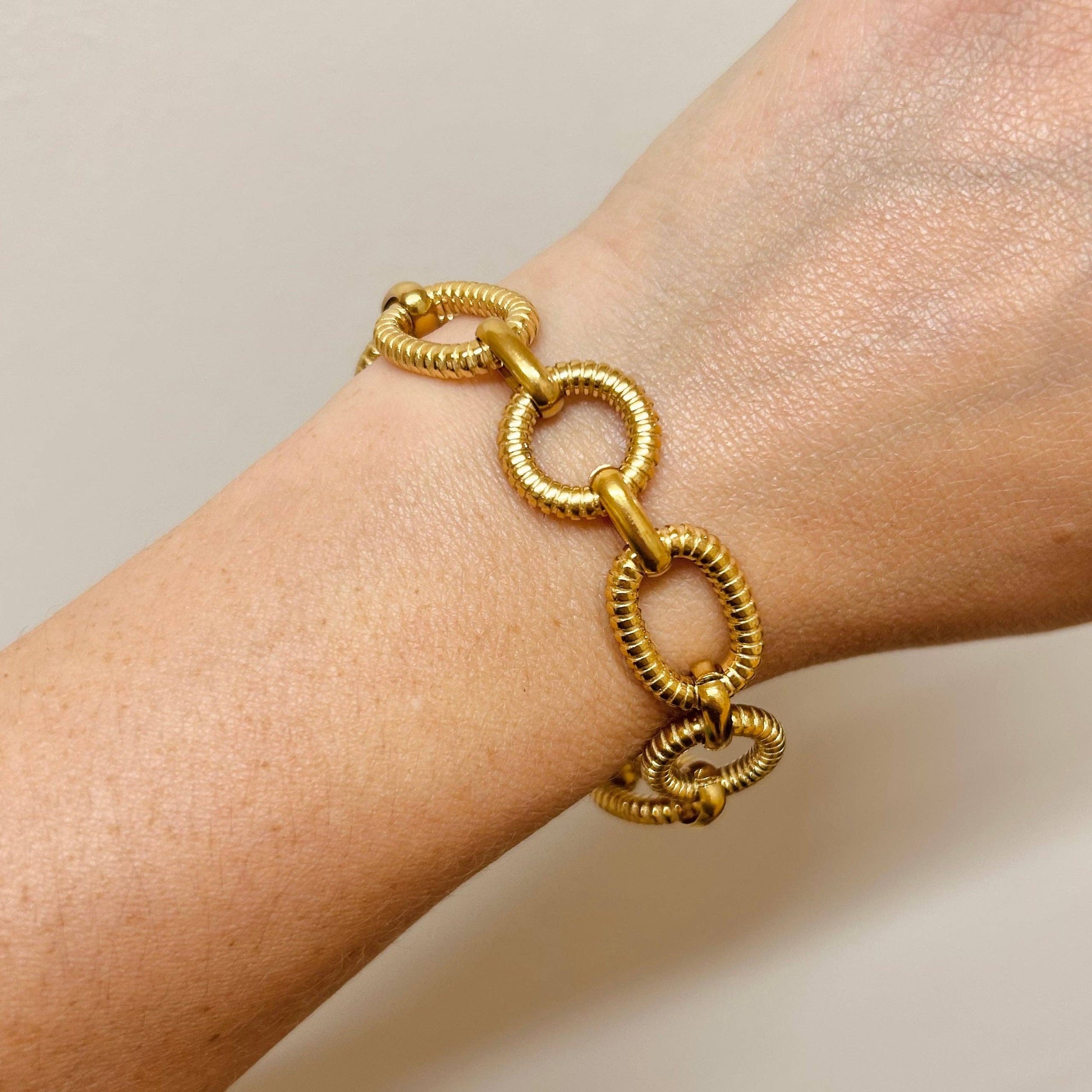 Close up of Gold T Bar Fastening on Bracelet