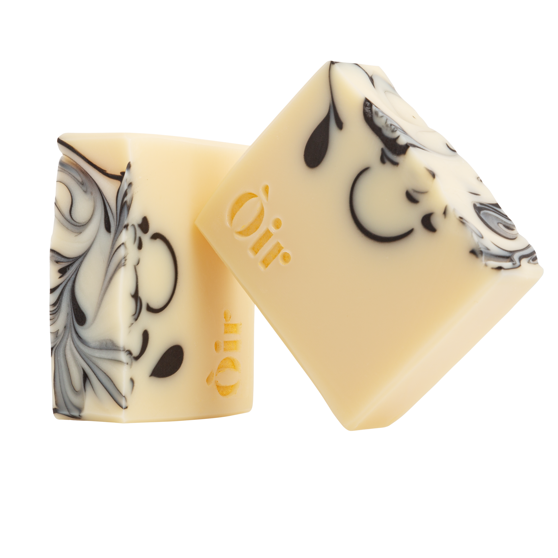 Cedarwood, Clary Sage, Rose Geranium and Vetiver Soap. Handmade in the UK. A sustainable replacement for shower gel. The soap is a cream bar with beautiful, gold lettering with the word OIR| and black swirls in the soap.