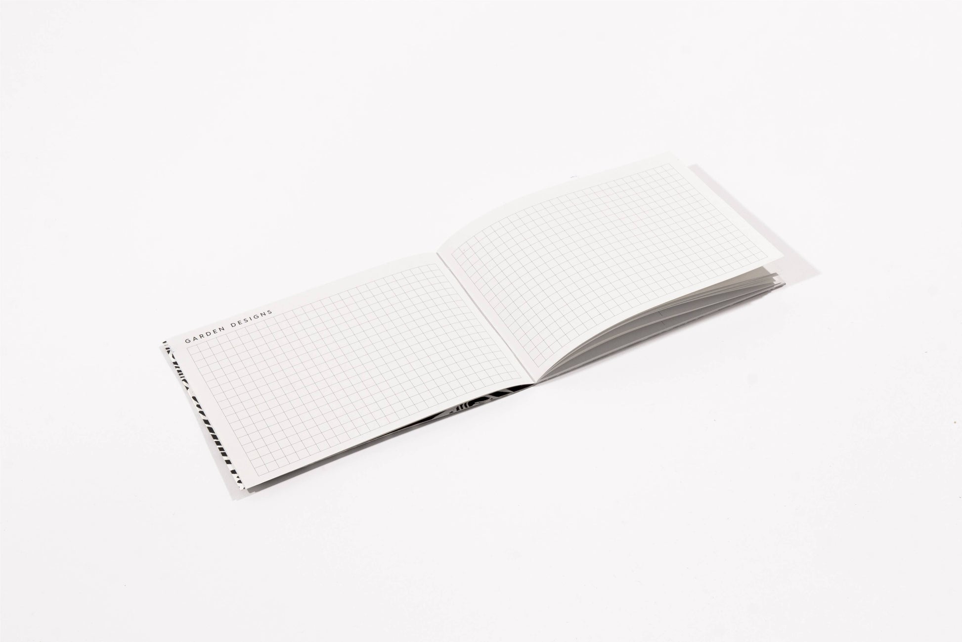 Open pages of the Gardeners Diary, grid pages.