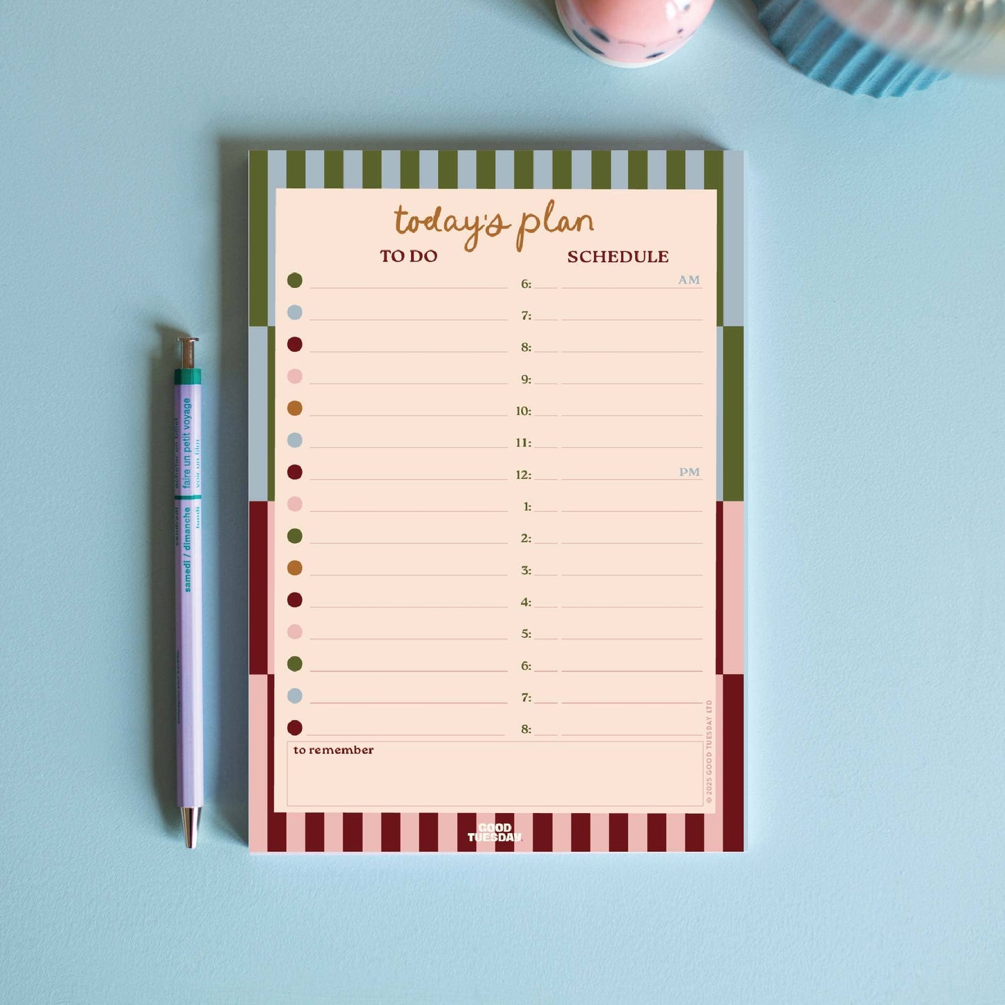A5 Boho Nouveau Daily Planner Pad with to-do list and schedule sections on a desk