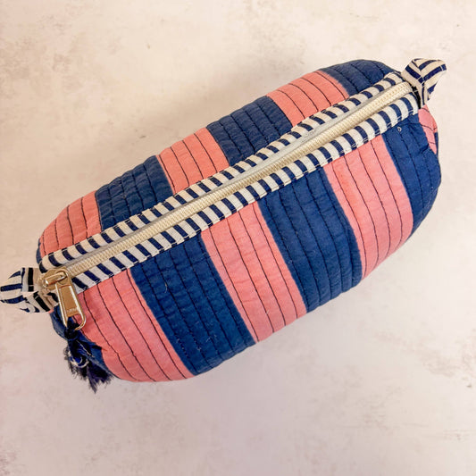 Medium sized pink and navy striped wash bag with waterproof lining