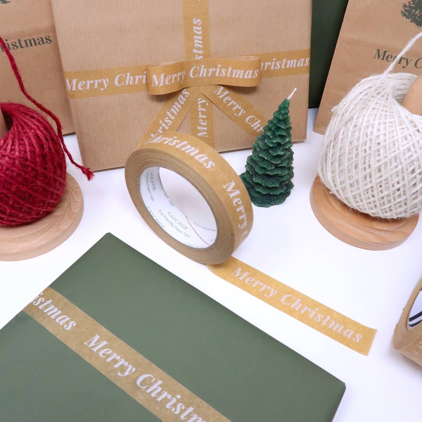 Merry Christmas Paper Tape, 24mm wide 50m roll, plastic-free recyclable kraft, vegan plant-based adhesive, eco-friendly holiday gift wrap tape.