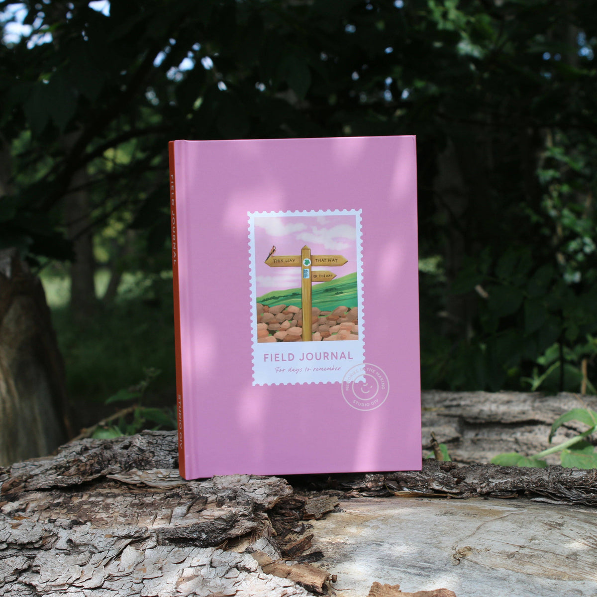 Hiking Field Journal styled with outdoor gear and walking boots