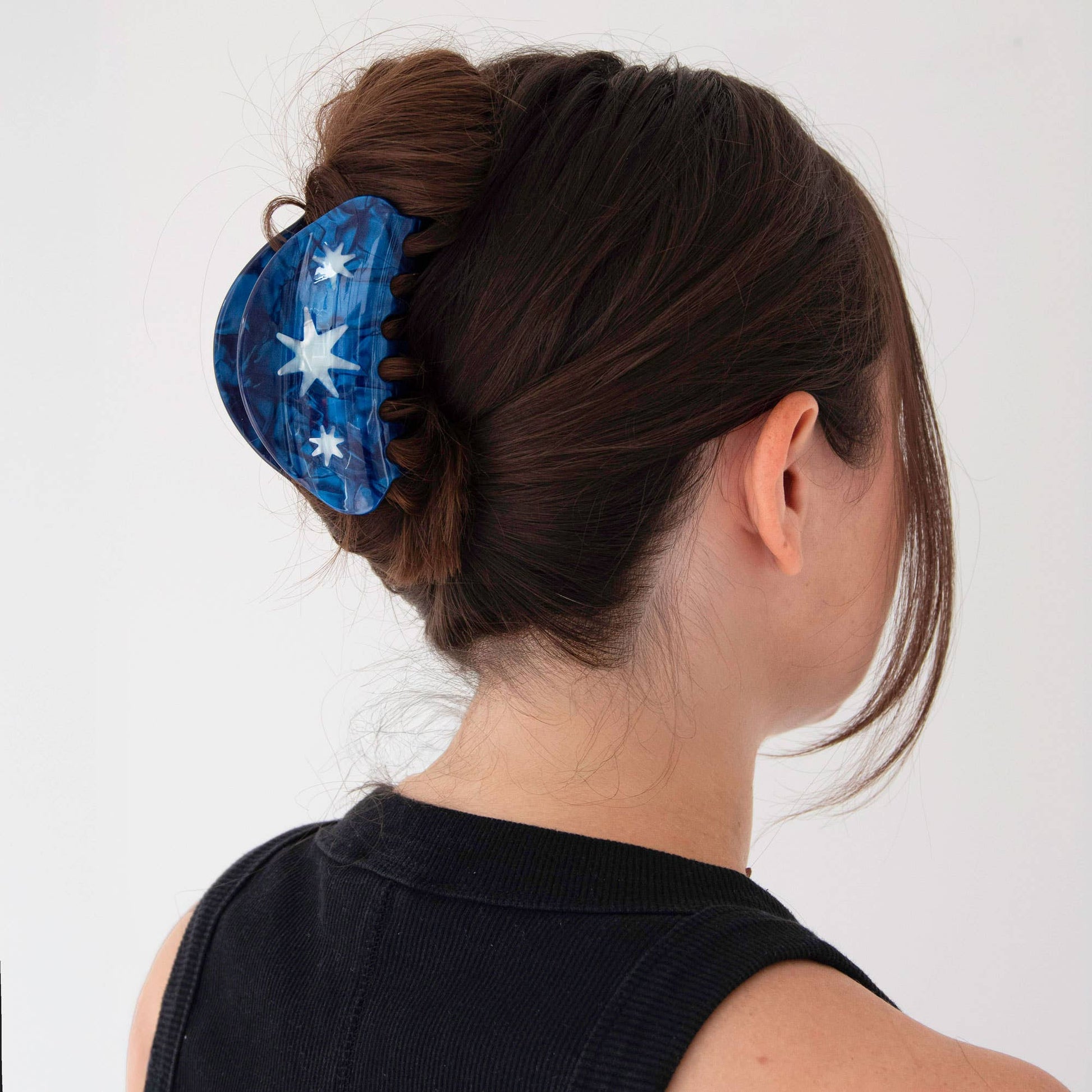 Model wearing Pepper You Hand Drawn Star Medium Hair Claw Clip in hair.