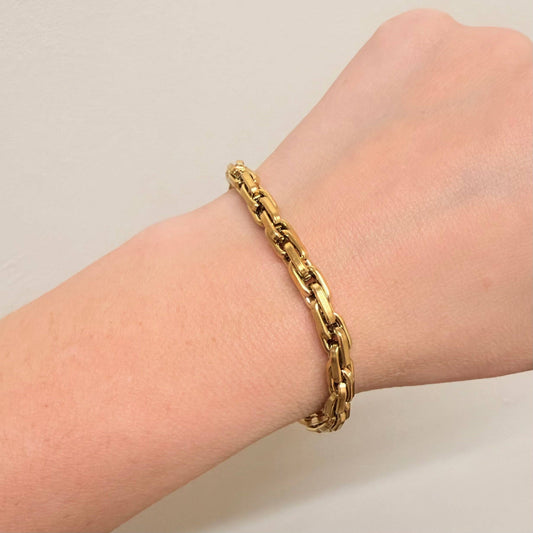 Close up of gold box chain links and extender