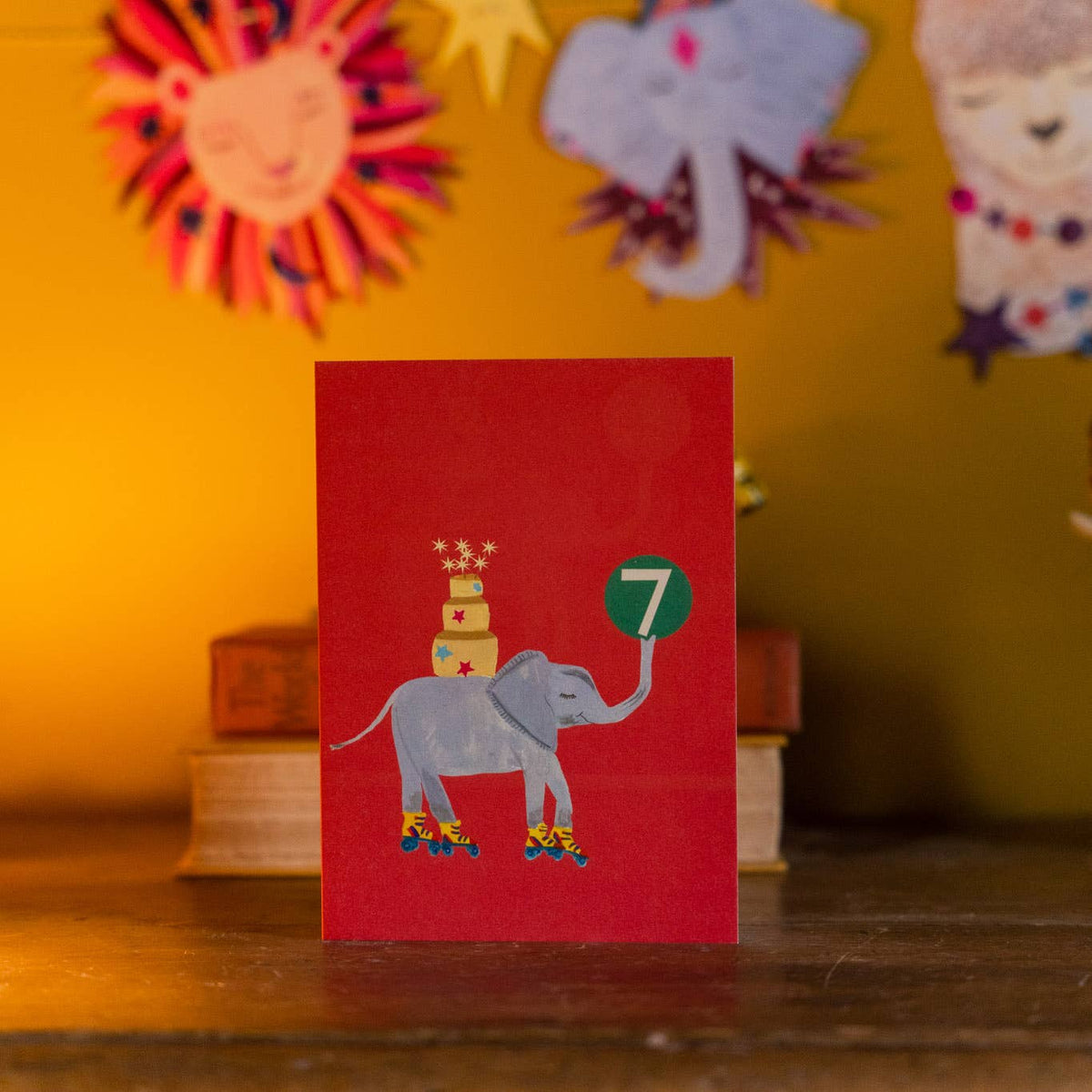 Whimsical elephant with birthday cake illustration on age 7 card
