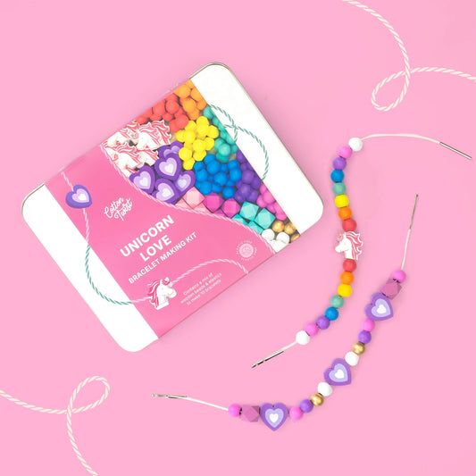 Unicorn love bracelet making kit with colourful wooden beads on a pink background