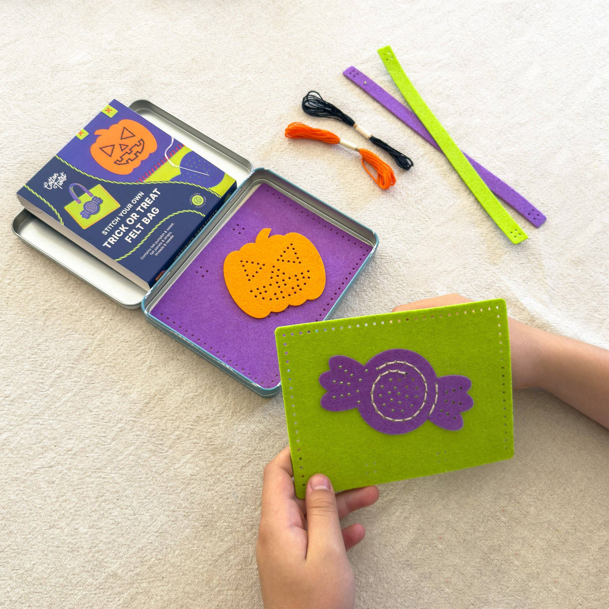 Two completed felt Halloween trick or treat bags: pumpkin and sweet designs