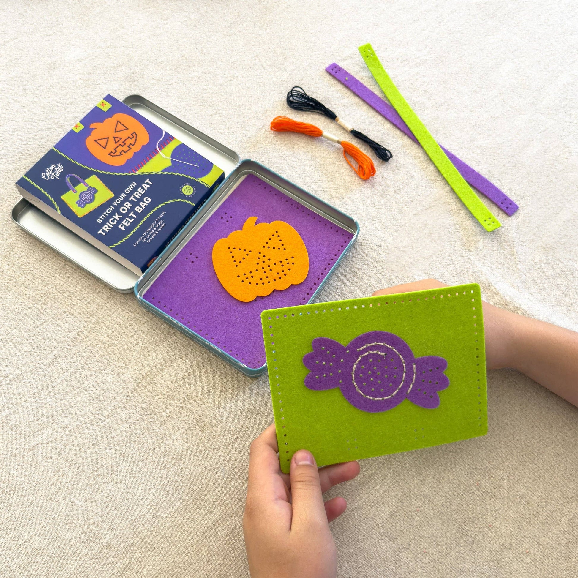 Two completed felt Halloween trick or treat bags: pumpkin and sweet designs