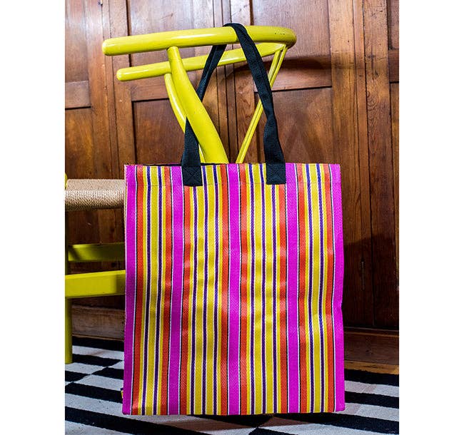 Eco Woven Market Shopper in Neyron, Guardsman and Pearl. A colourful, sustainable shopper with sturdy handles and a magnetic popper closure. This bag is made from threads spun from recycling old cement sacks!