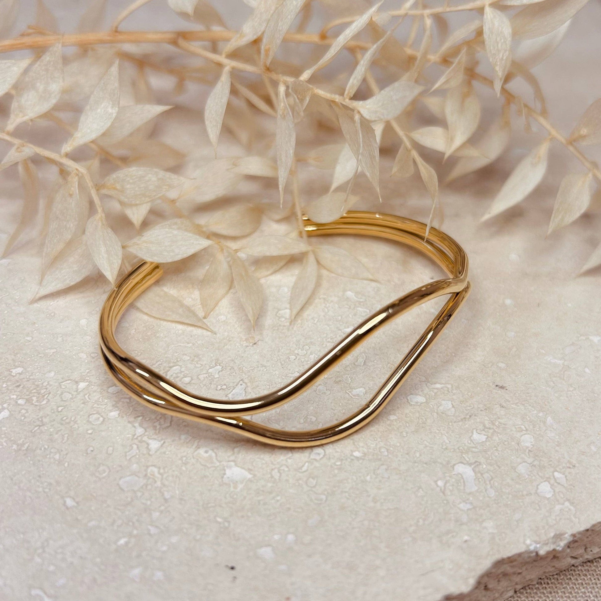 Stack of 18k gold plated abstract bangles, showcasing versatility