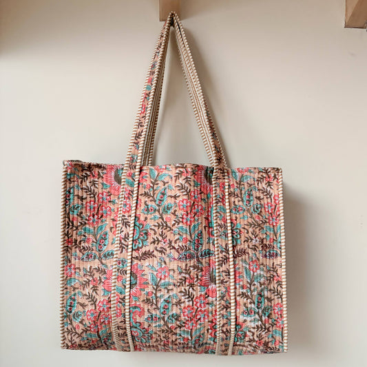 Block printed cotton quilted tote bag with intricate floral design