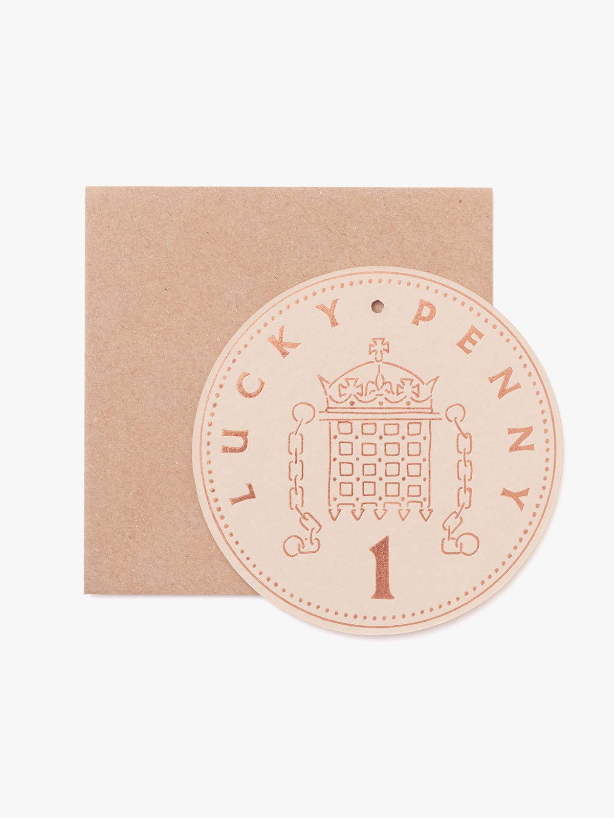 Close up of hot foil pressed Lucky Penny Token