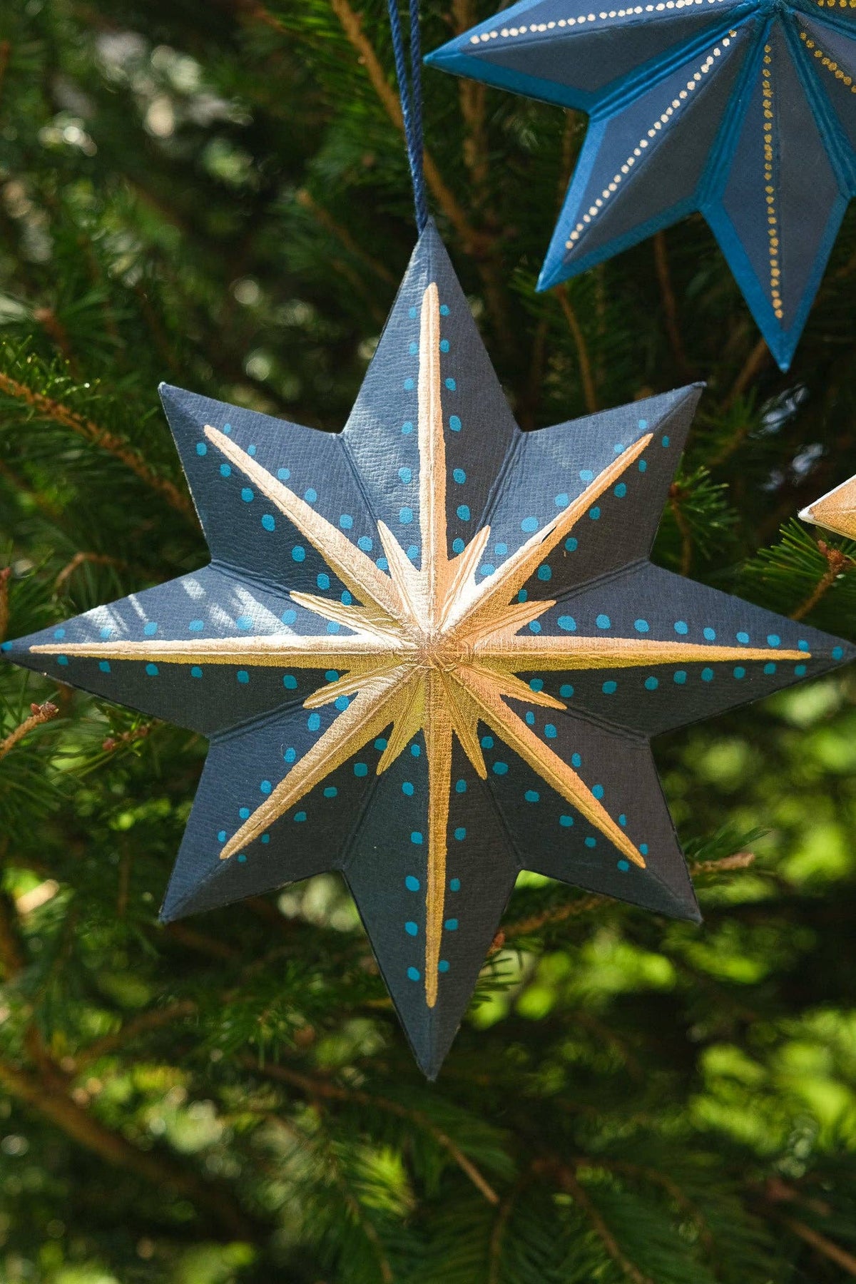 Twinkling Star decoration showing 10cm cotton hanging loop