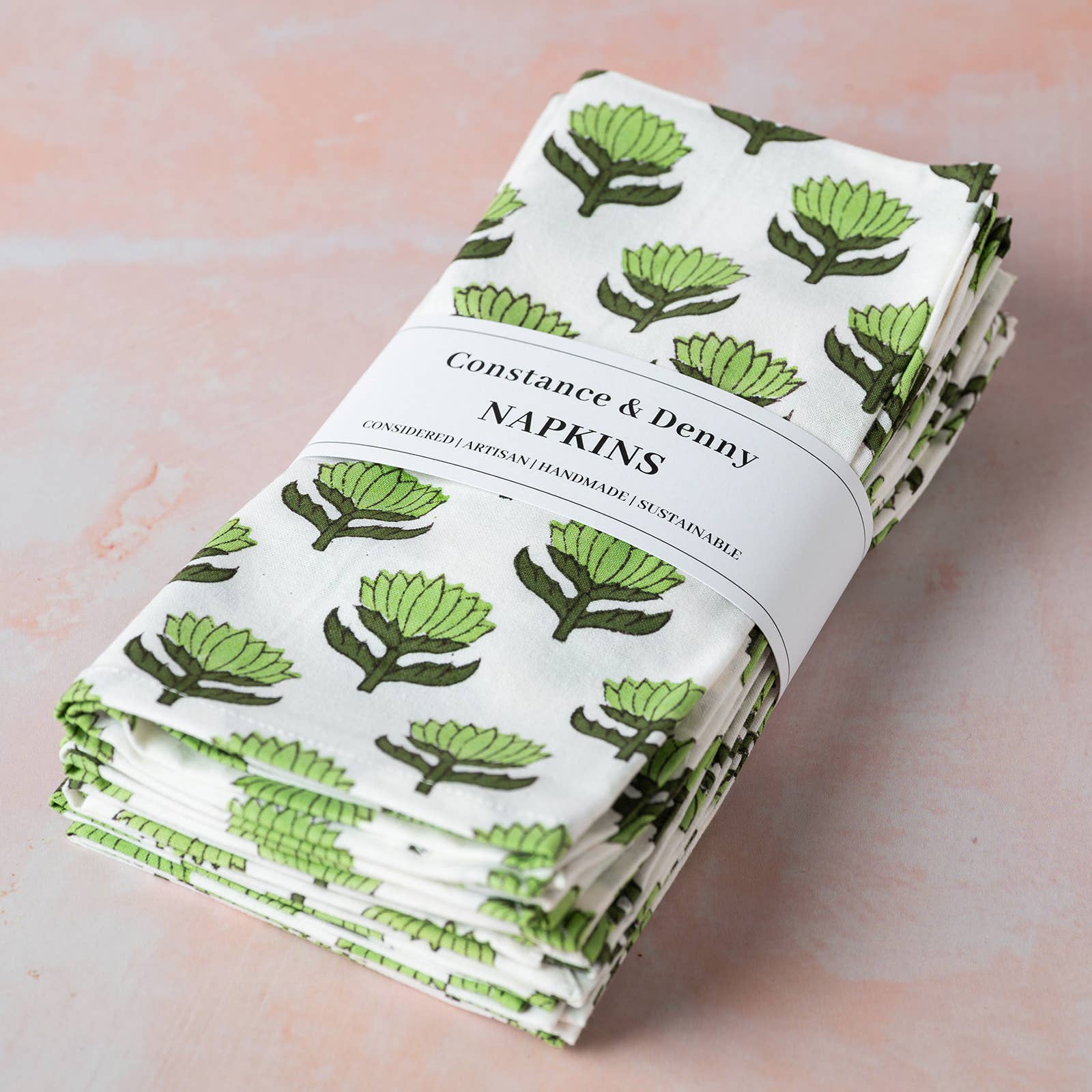 Set of six Lotus Flower Green cotton napkins on a table