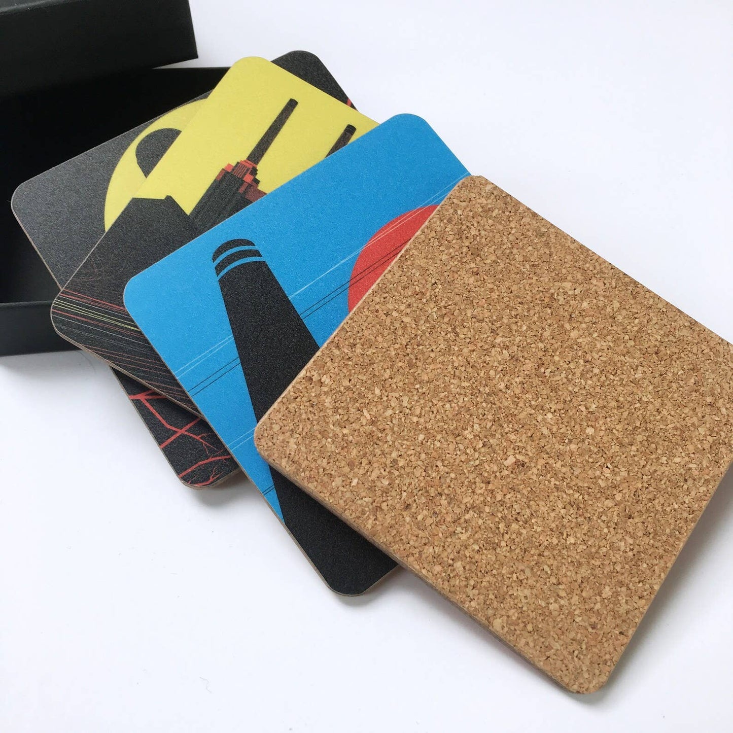 Industrial London Coaster Gift Set. Set of 4 coasters featuring London Landmarks. Battersea, Hackney, Croydon and Brick Lane Gasholders and chimneys. The gritty, not so pretty side of industrial London. Featuring the Battersea Power station, the gasworks at Waddon Marsh Croydon, the chimney of the Old Truman Brewery, and the gas holders by the canal in Hackney, as seen from an overground train. The coasters have a cork back.