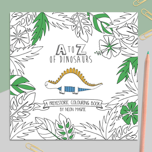 Open Dinosaur Colouring Book by Megan Hicklin, showcasing pen and ink artwork with coloured pencils.