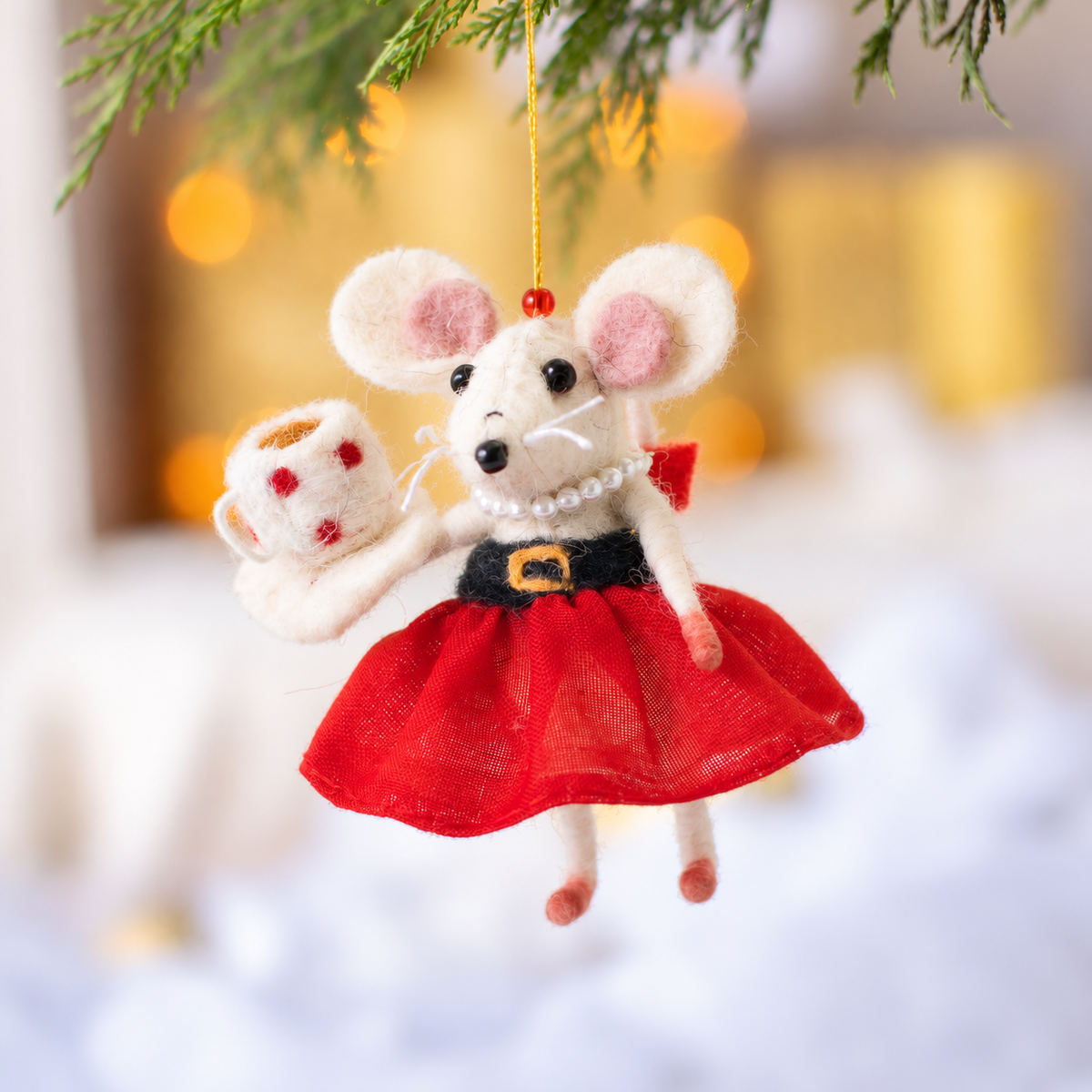 Detail of needle felted Mrs Claus mouse in red skirt and pearl necklace