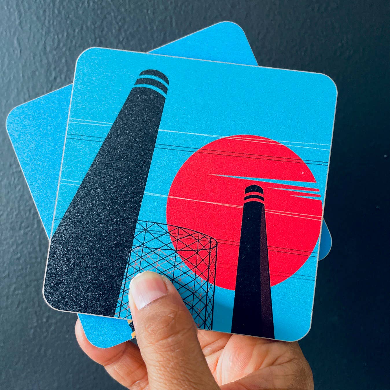 Industrial London Coaster Gift Set. Set of 4 coasters featuring London Landmarks. Battersea, Hackney, Croydon and Brick Lane Gasholders and chimneys. The gritty, not so pretty side of industrial London. Featuring the Battersea Power station, the gasworks at Waddon Marsh Croydon, the chimney of the Old Truman Brewery, and the gas holders by the canal in Hackney, as seen from an overground train. 