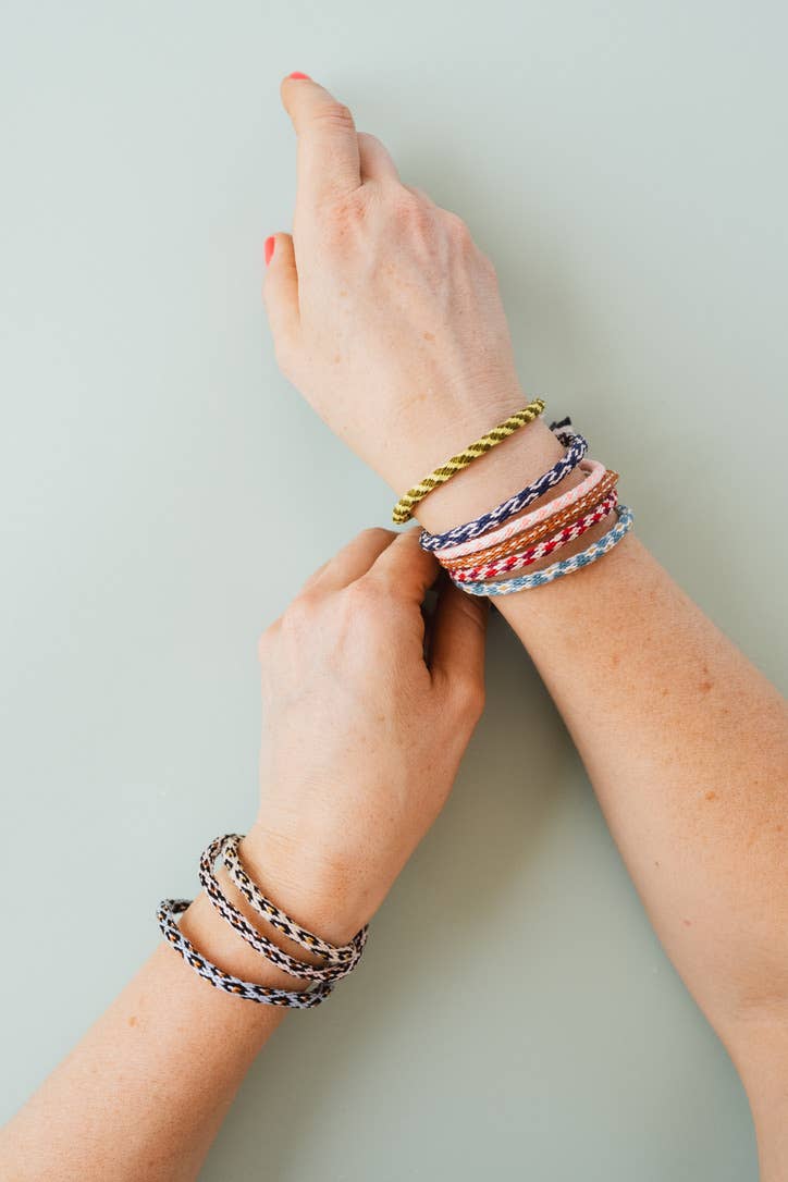 Complete Kumihimo bracelet kit contents laid out