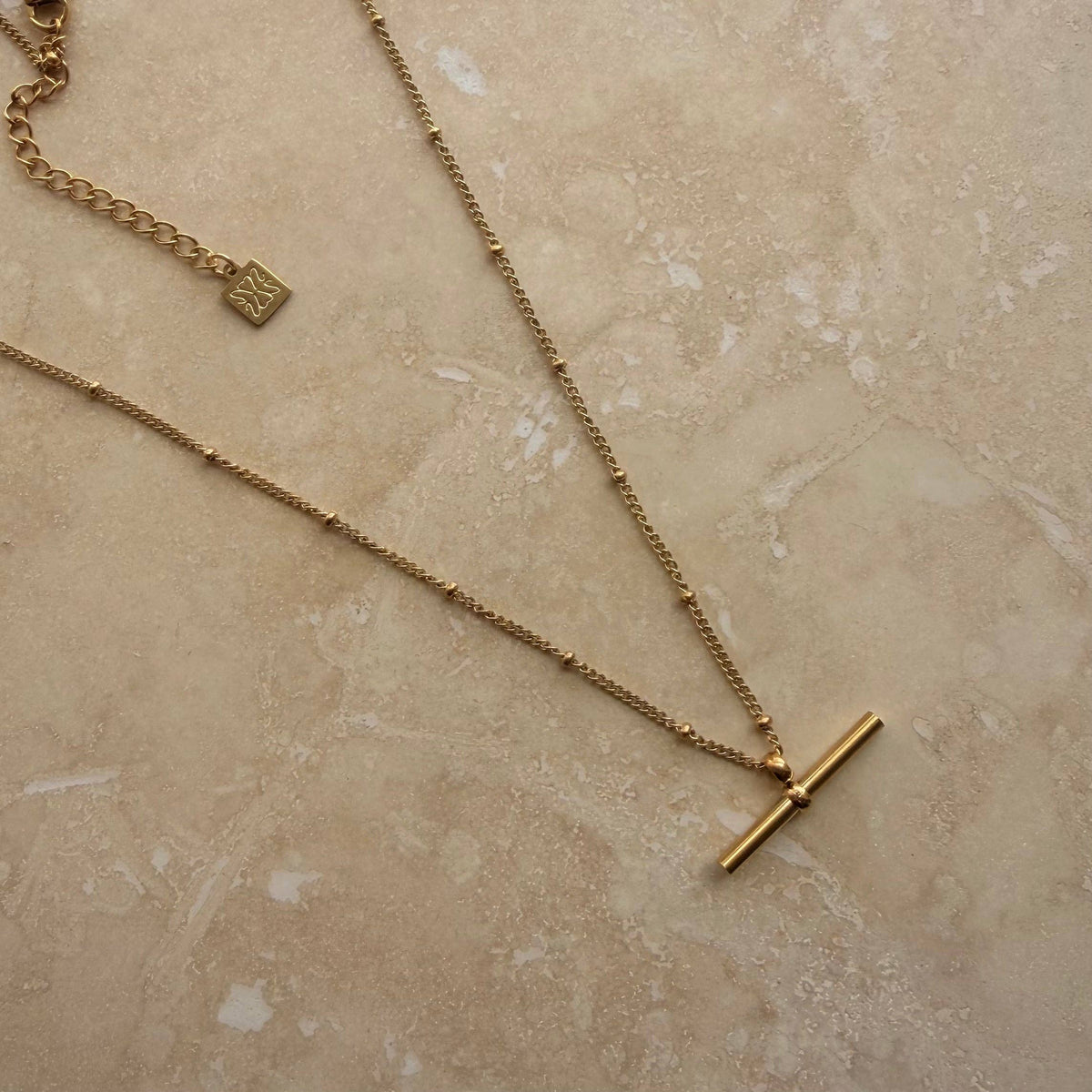 Everyday gold bar necklace on a delicate ball chain
