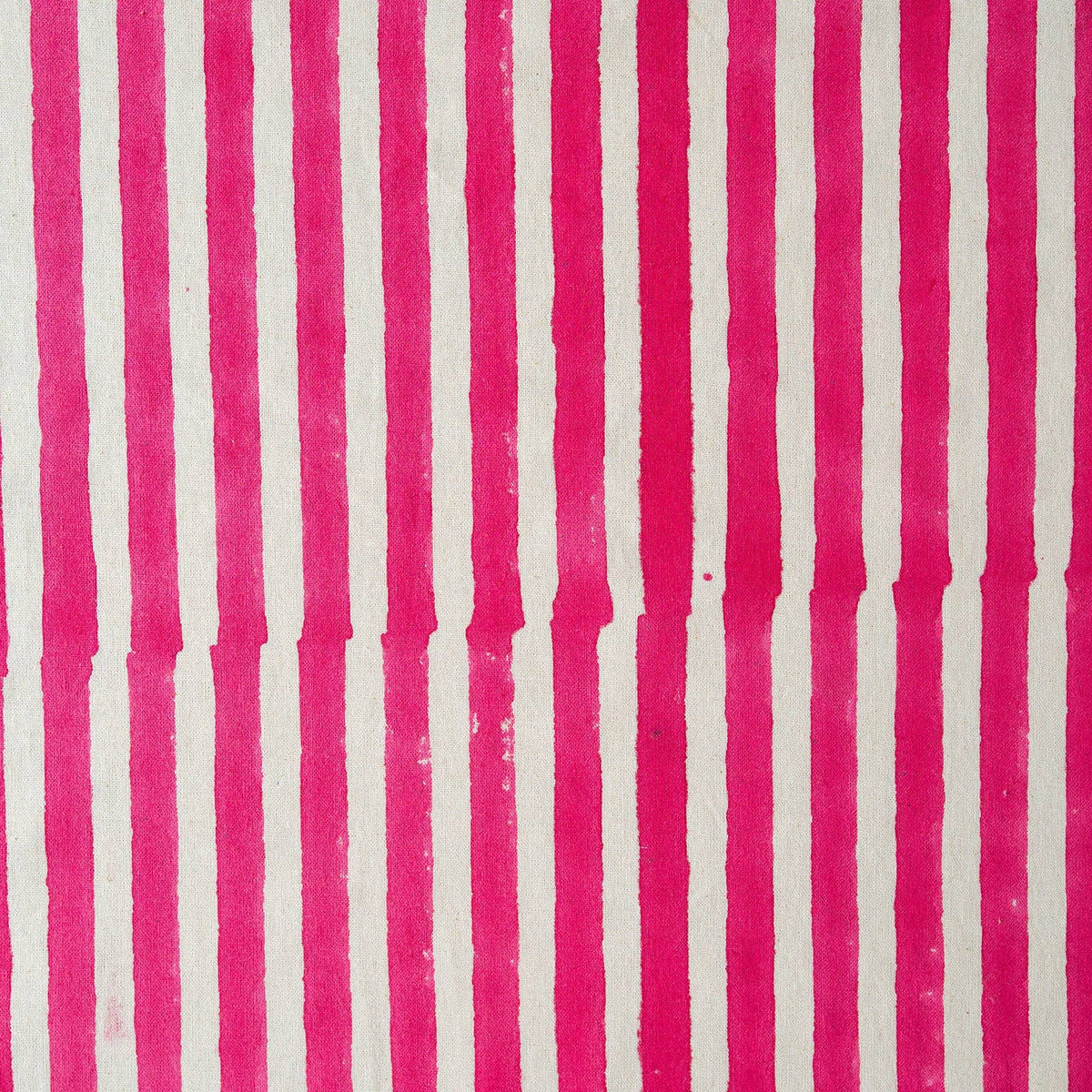 Close up of hand-block printed pink stripe pattern