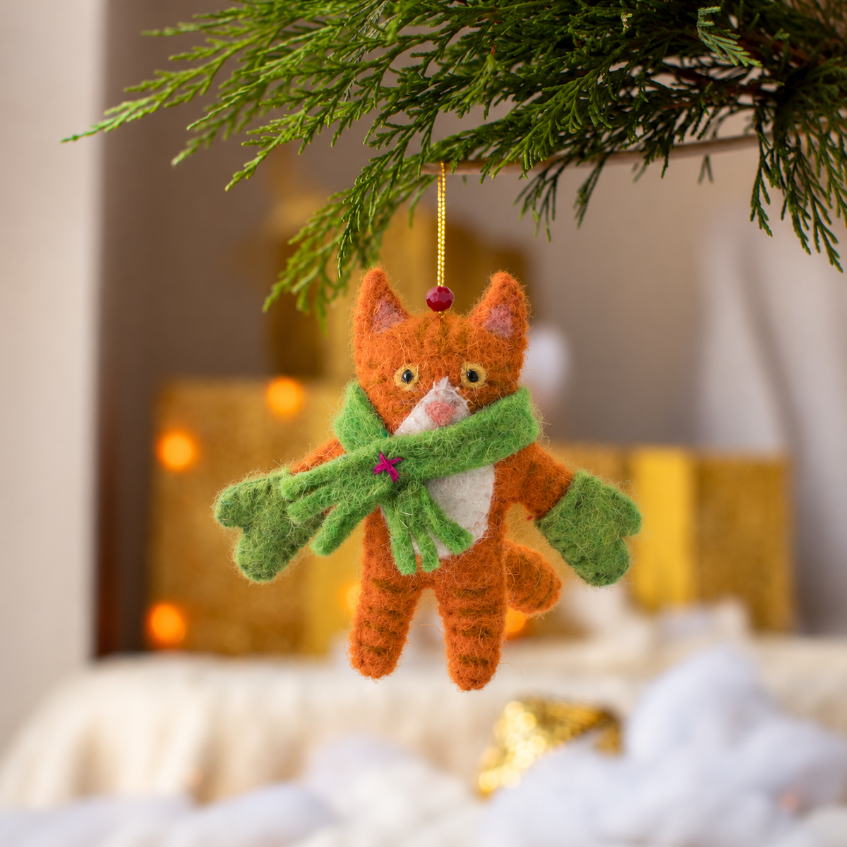 Detailed view of needle felted organic wool ginger kitten ornament