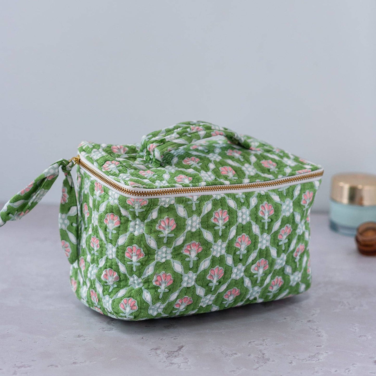 Spacious cube-shaped cosmetic case in pink and white petal print