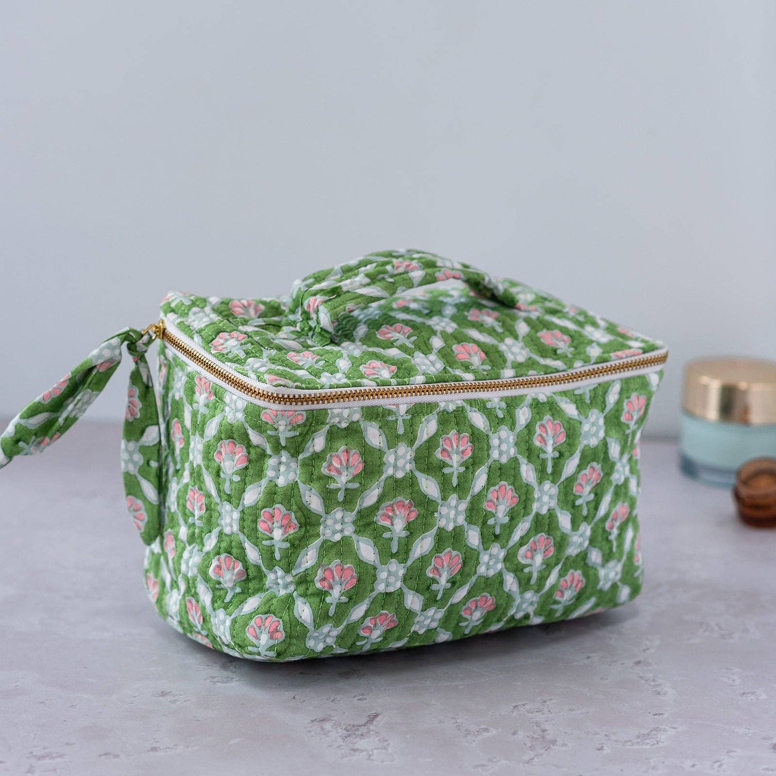 Spacious cube-shaped cosmetic case in pink and white petal print