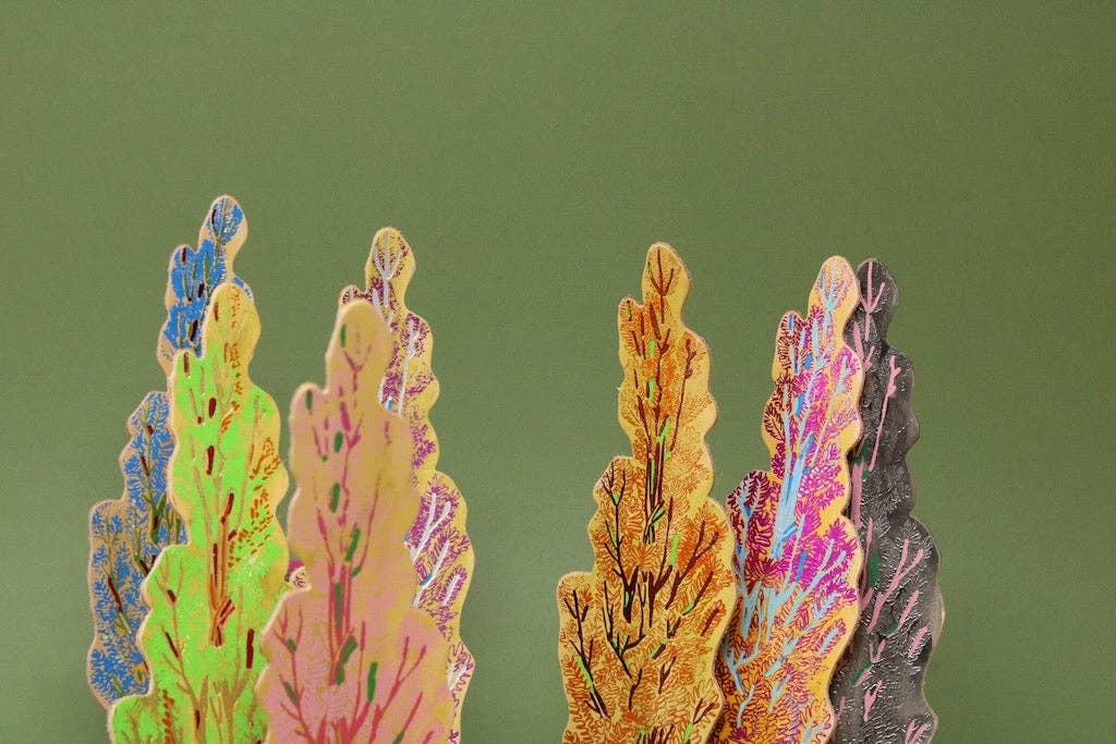 Close up of foiled Tree Hugger design on vegetable tan leather