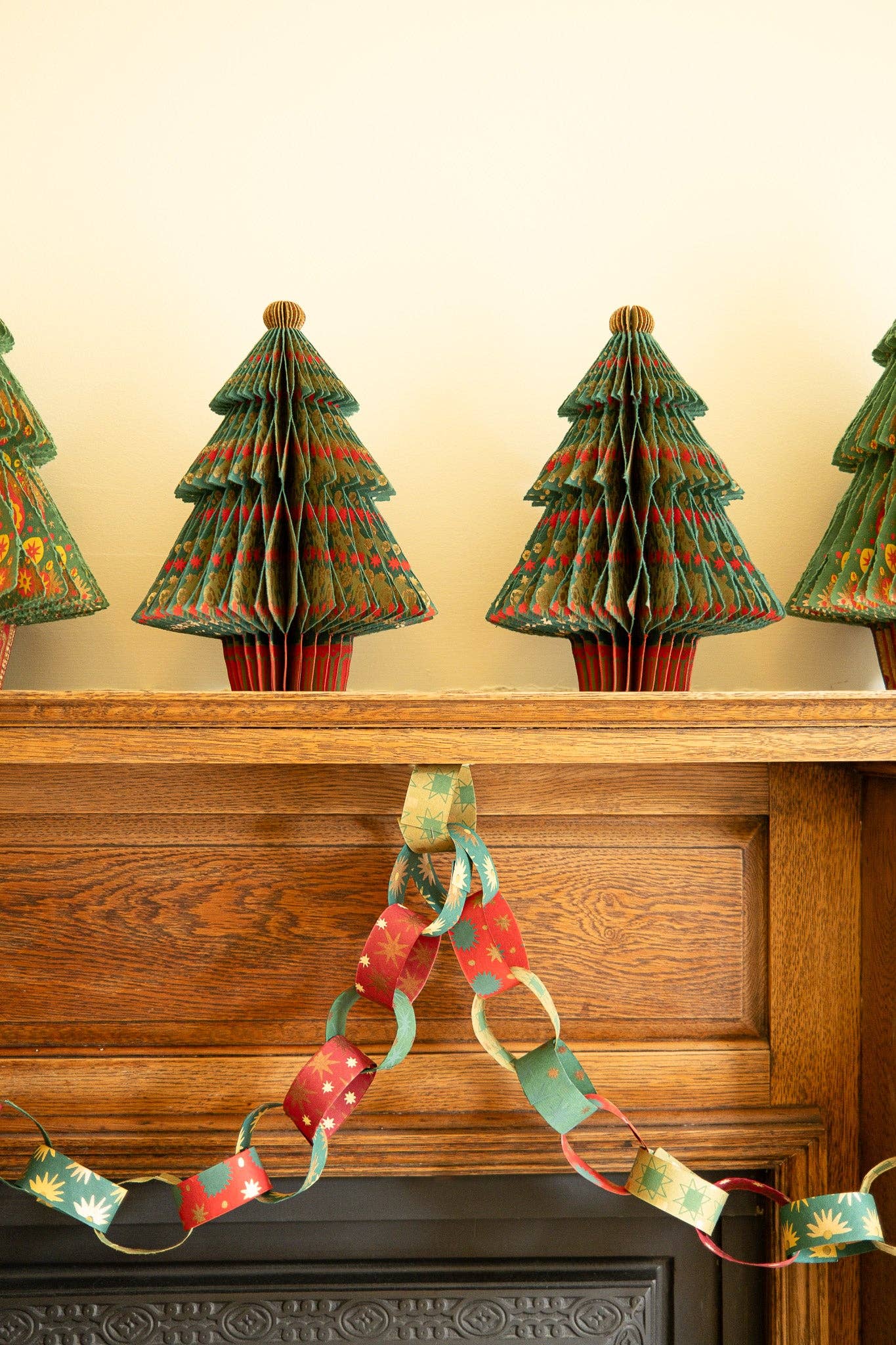 Recycled festive paper chain strips, hand-printed double-sided, eco-friendly decoration kit.