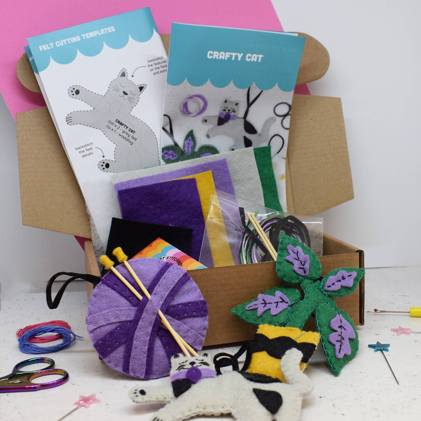 Crafty Cats Felt Stitching Set. Three felt hanging decorations. A cat, a ball of wool and a plant.