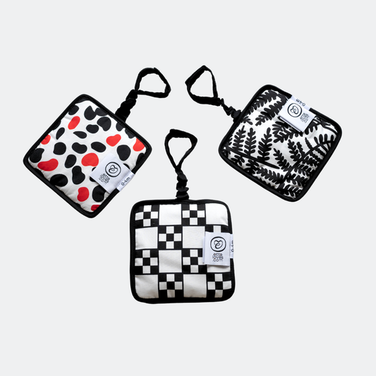 Triple pack of Etta Loves sensory hanging squares in fern/sycamore, chequers/illusion, and dalmatian/mirror designs, approx 13cm, with sensory features and velcro attachments.