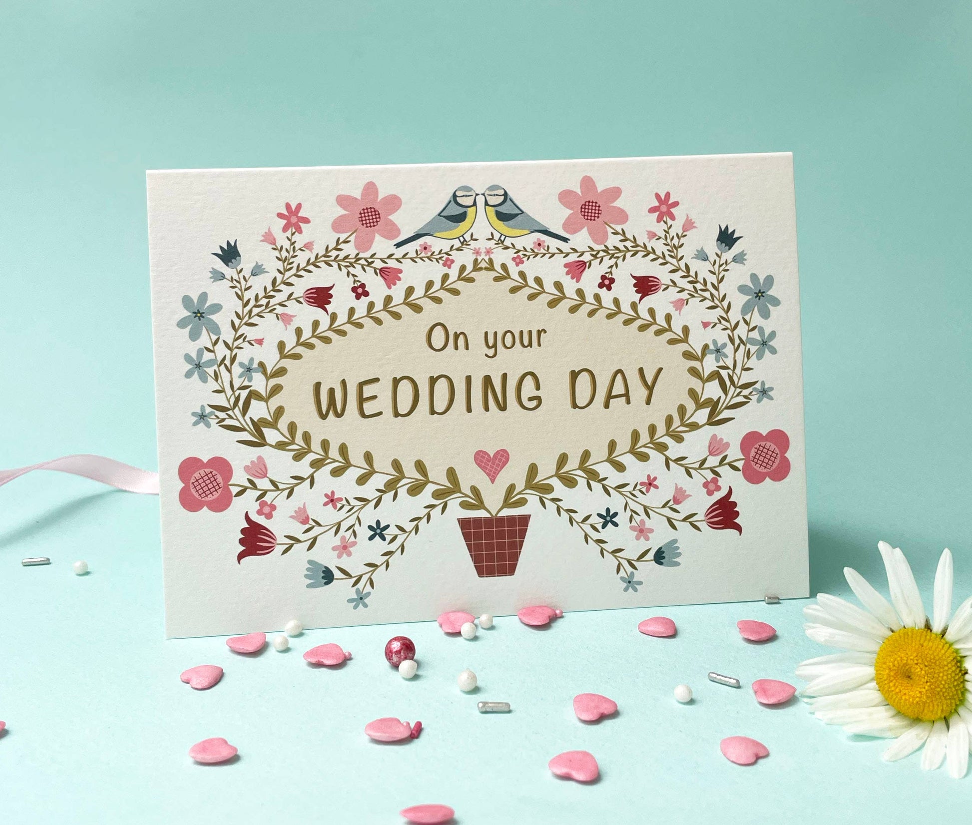 Folk floral wedding card shown with its recycled kraft envelope