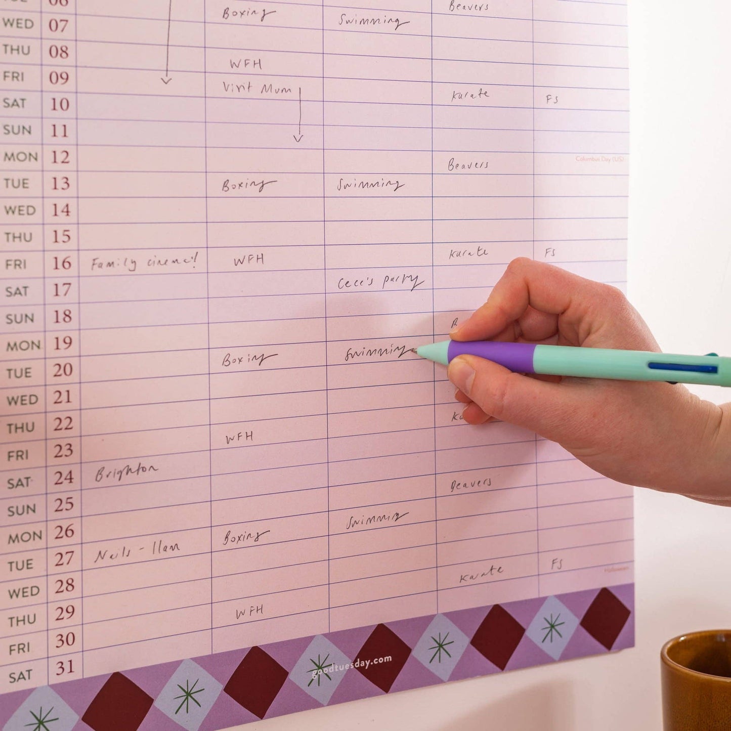 Close up of columns and dates on recycled paper family wall calendar