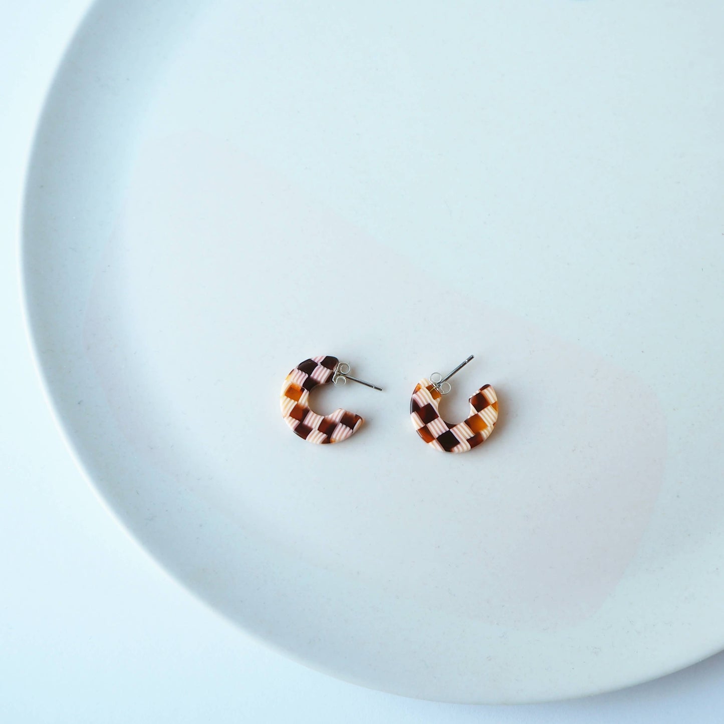 Side view of chunky honey checkerboard hoop earrings