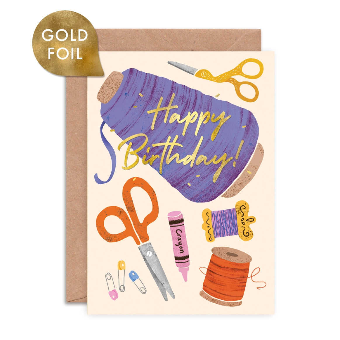 Birthday card with sewing-themed illustrations and gold foil text on a beige background