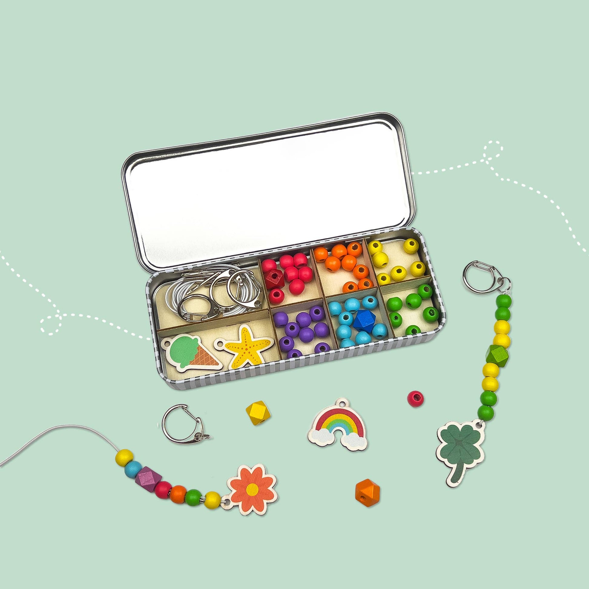 The Lucky Dip Keyring making kit is a wonderful plastic free activity. It offers a selection of wooden fobs to include a clover, flower, starfish, ice cream &amp; a rainbow, allowing children to create 5 keyrings. The kit also comes with rainbow coloured spacer geometric beads to complement the showpiece beads for vibrant accessories!